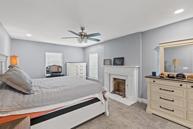 carpeted bedroom with ceiling fan