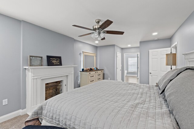 carpeted bedroom featuring ceiling fan