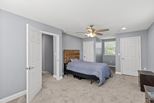 carpeted bedroom with ceiling fan