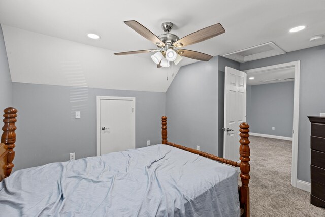 bedroom featuring carpet, ceiling fan, and vaulted ceiling