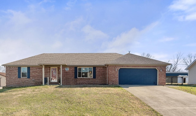 ranch-style house featuring a garage and a front lawn