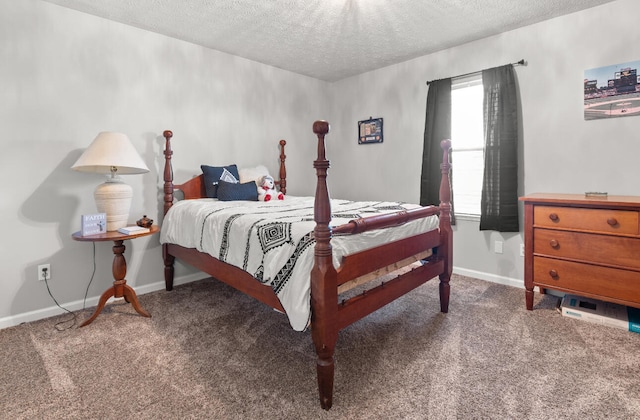 bedroom featuring carpet floors and a textured ceiling