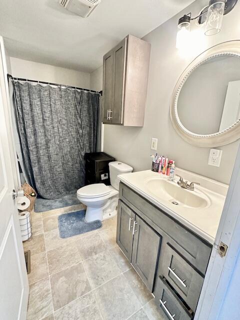 bathroom with vanity and toilet