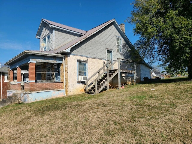 back of house with a yard and cooling unit