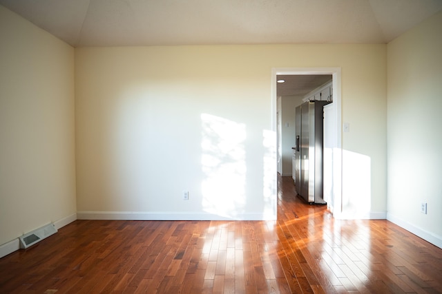 unfurnished room featuring dark hardwood / wood-style floors