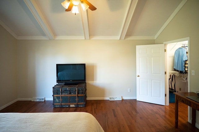 bedroom featuring dark wood-type flooring, ceiling fan, and vaulted ceiling with beams