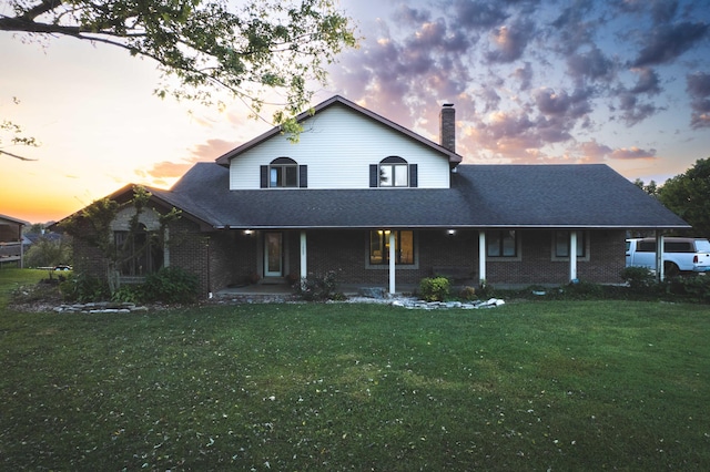 view of front of house with a yard