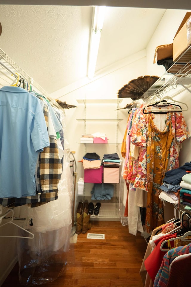 spacious closet featuring hardwood / wood-style floors