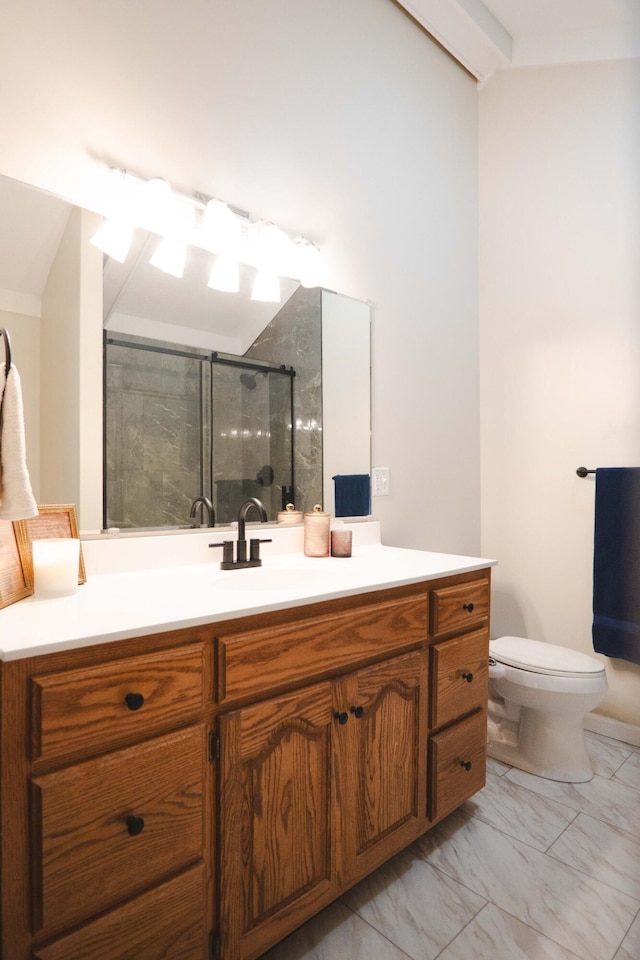 bathroom featuring vanity, toilet, an enclosed shower, and vaulted ceiling