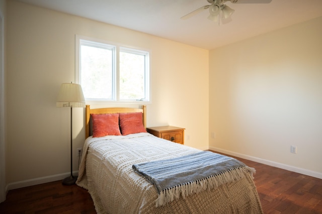 bedroom featuring ceiling fan and dark hardwood / wood-style floors