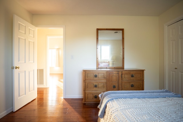 bedroom featuring a closet and hardwood / wood-style floors