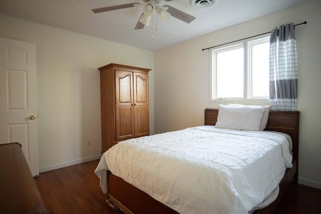 bedroom featuring ceiling fan and dark hardwood / wood-style floors