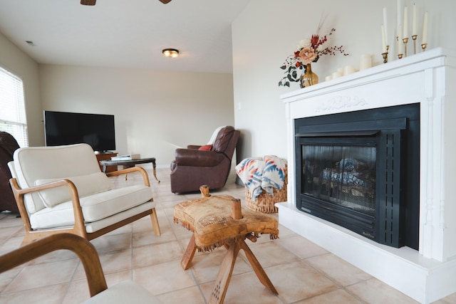 tiled living room featuring vaulted ceiling