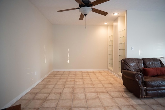 interior space with ceiling fan