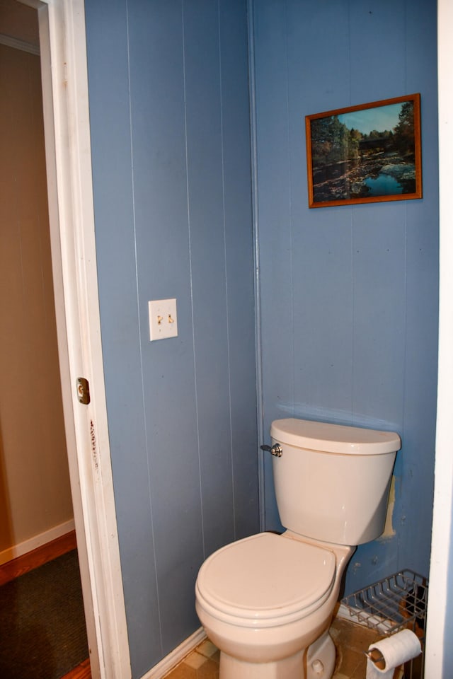 bathroom with tile patterned flooring and toilet