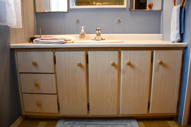 bathroom featuring tile patterned flooring and sink