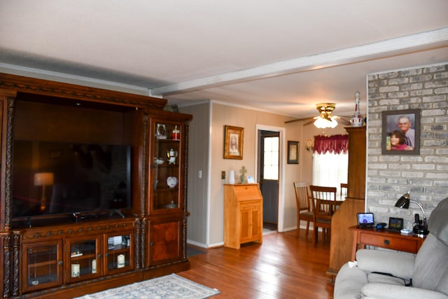 living room with ceiling fan, ornamental molding, and hardwood / wood-style floors