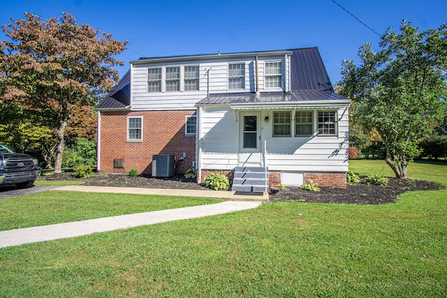 front of property with covered porch and a front lawn