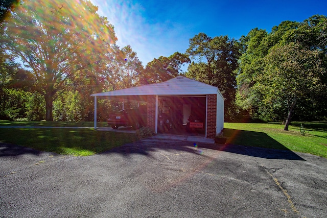 garage featuring a yard