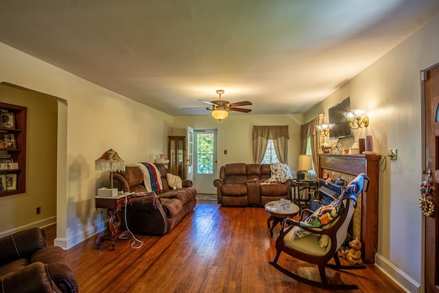 living room with ceiling fan and dark hardwood / wood-style floors