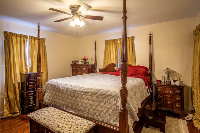 bedroom with ceiling fan and dark hardwood / wood-style floors