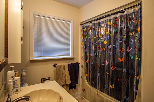 bathroom featuring vanity and shower / bath combo