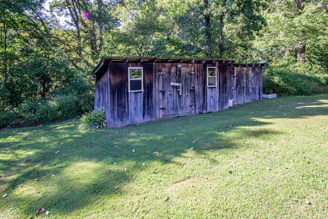 view of outdoor structure with a lawn