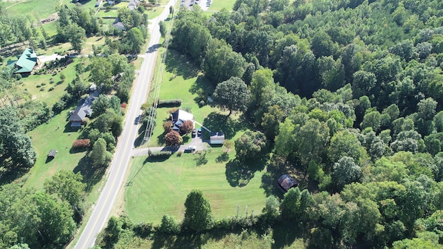 birds eye view of property with a rural view