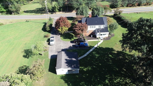 birds eye view of property with a rural view