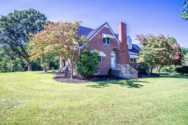 view of side of property with a yard