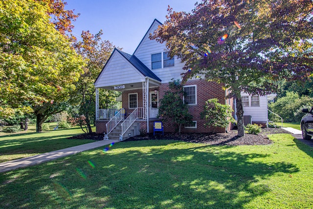 view of front of home with a front lawn and covered porch