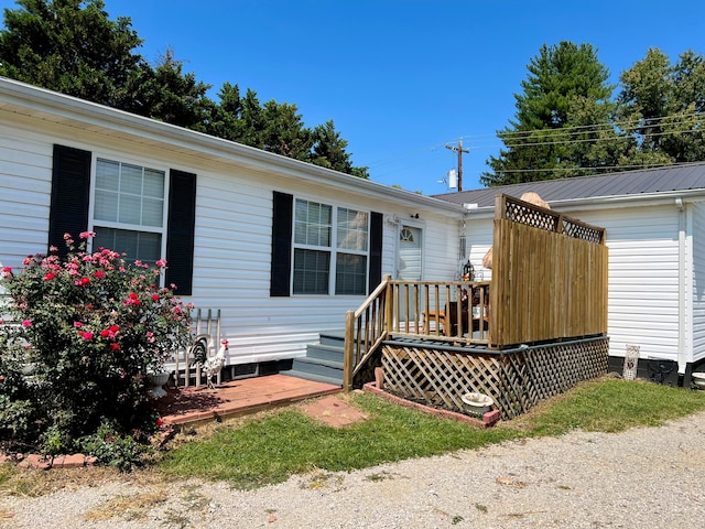 exterior space featuring a wooden deck