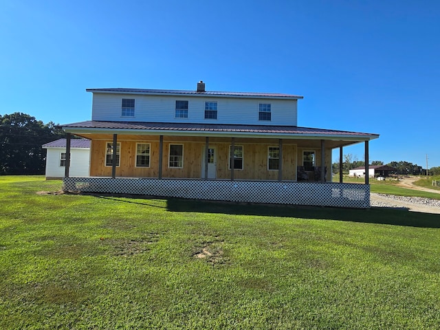 back of house with a yard and a porch