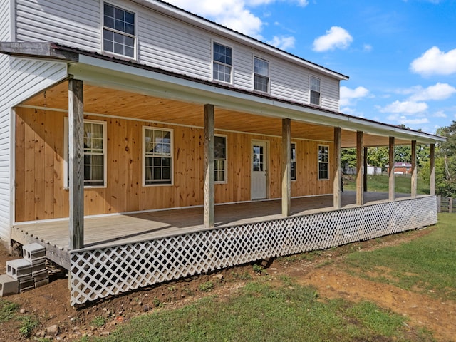 rear view of property with a porch