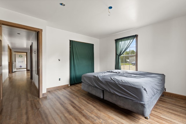 bedroom featuring dark hardwood / wood-style flooring