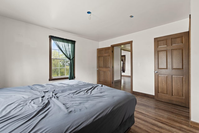 bedroom featuring dark hardwood / wood-style flooring