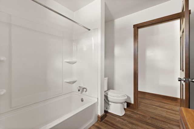 bathroom with shower / tub combination, hardwood / wood-style flooring, and toilet