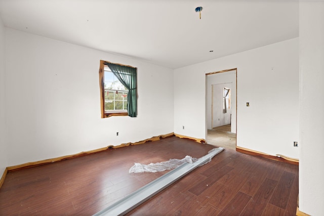 empty room featuring wood-type flooring