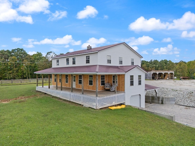 back of house featuring a lawn