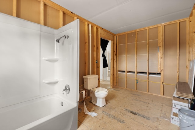 bathroom featuring shower / washtub combination and toilet