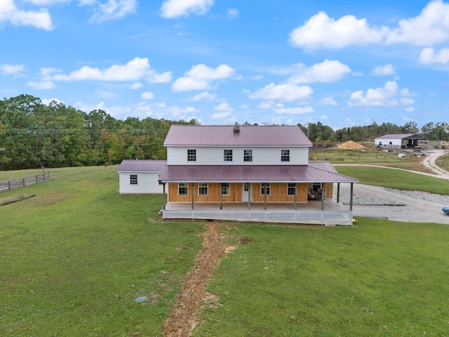 back of house with a lawn