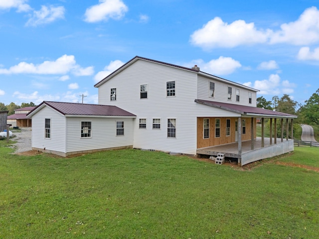 back of house with a yard