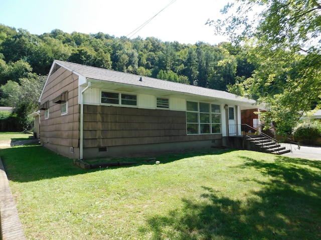 ranch-style house with a front lawn