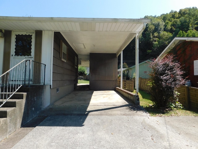 view of vehicle parking with a carport