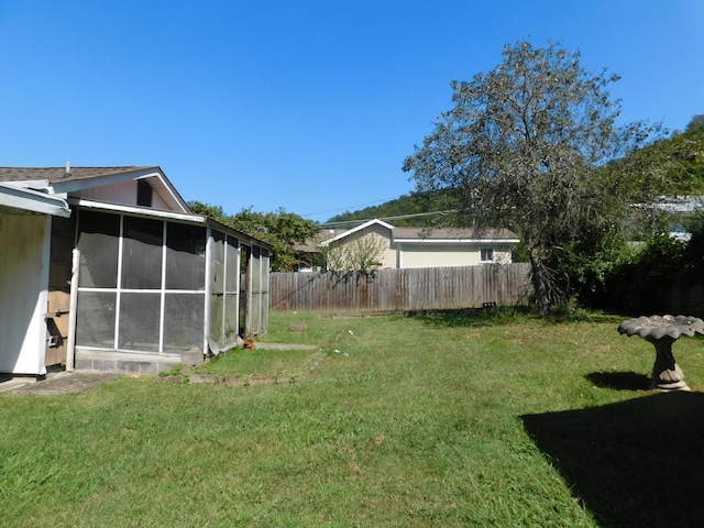 view of yard featuring a sunroom