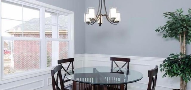 dining room with plenty of natural light and an inviting chandelier