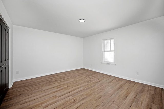 unfurnished room featuring light hardwood / wood-style floors