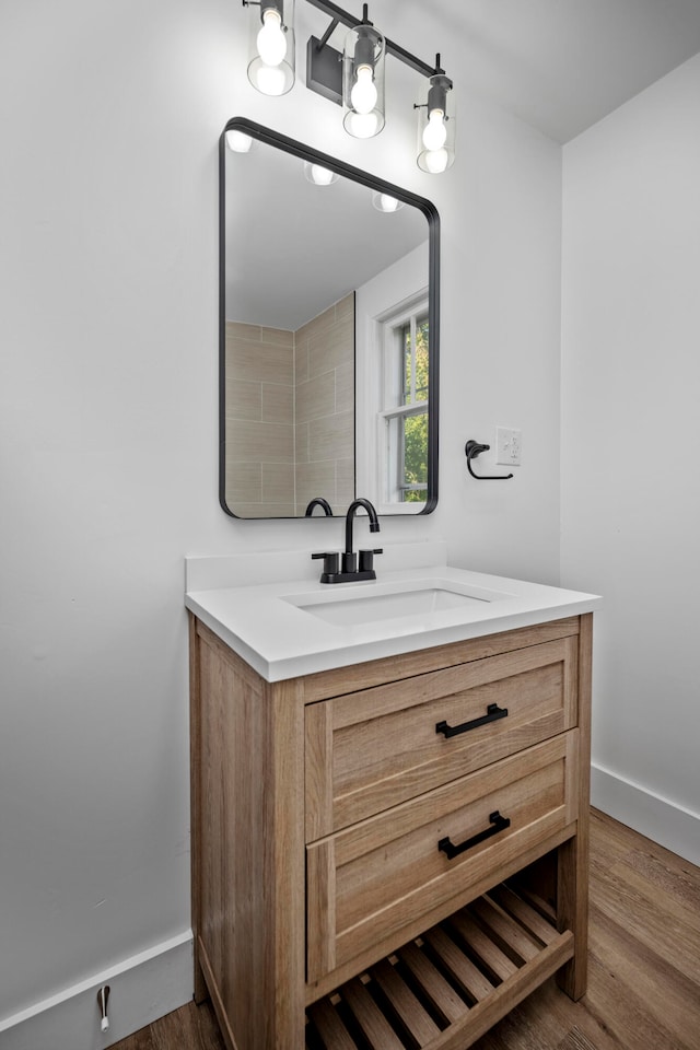 bathroom with vanity and hardwood / wood-style flooring