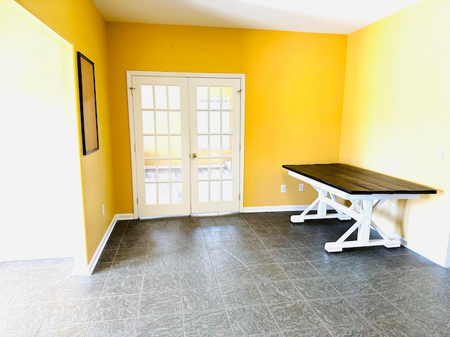 unfurnished dining area with french doors