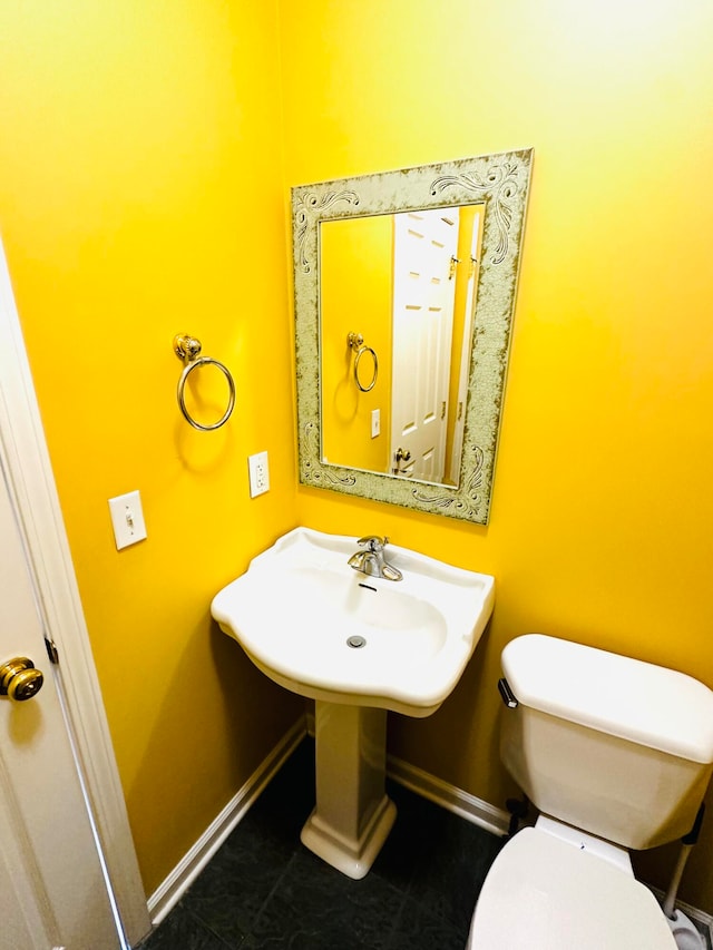 bathroom featuring tile patterned flooring and toilet